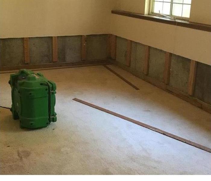an empty room with SERVPRO gear in it 