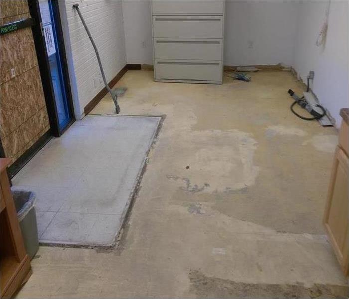 a repaired cement floor after a water event 