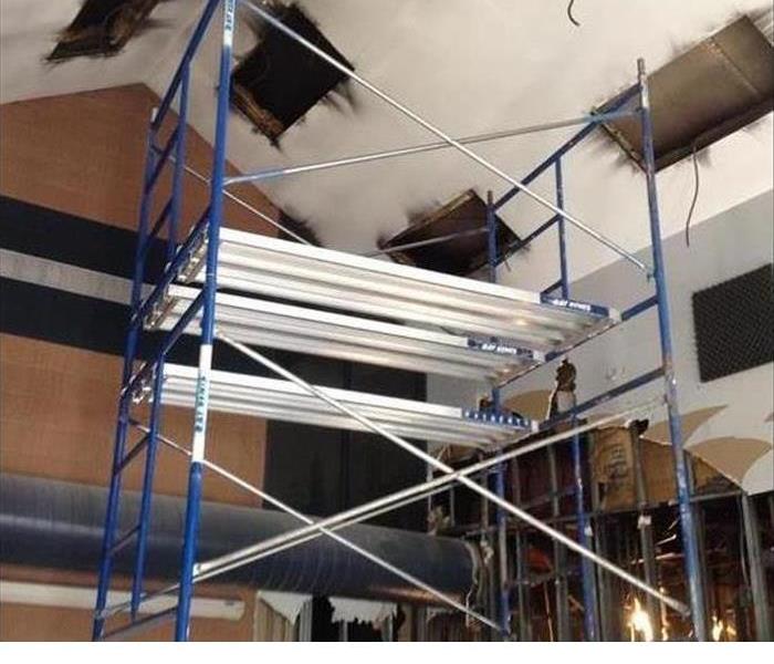 a fire damaged high ceiling at a business